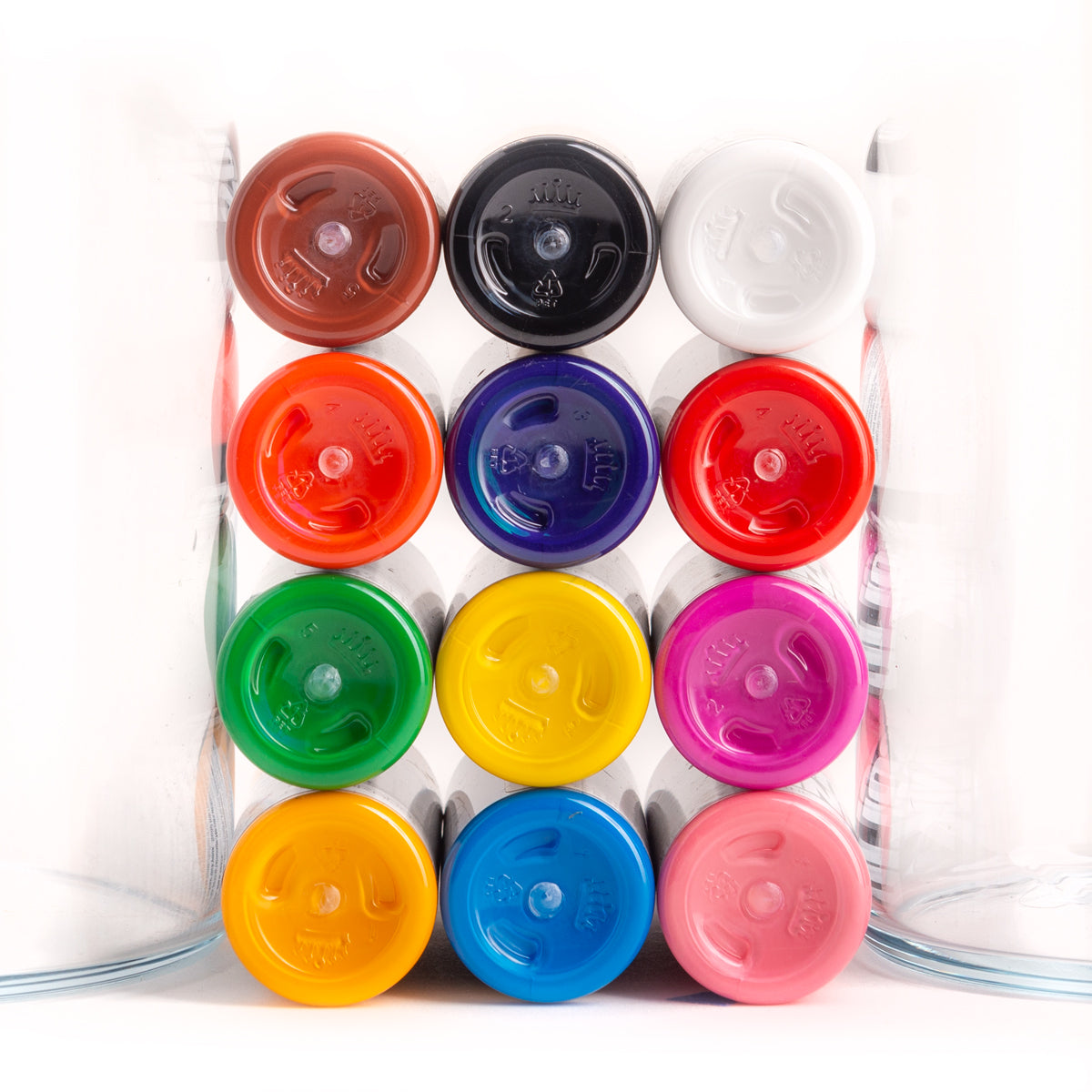 The bottoms of tattoo bottles from the 12 Color Spectrum Set, one of the Solid Ink Sets sold by TATSoul Premium Tattoo Supply.