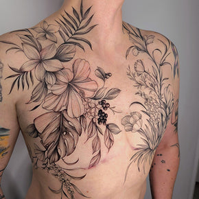 Floral tattoo design with large flowers and leaves across a person's chest.