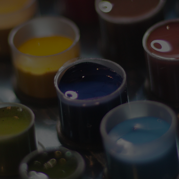 Containers of various paint colours, including blue, yellow, and brown.