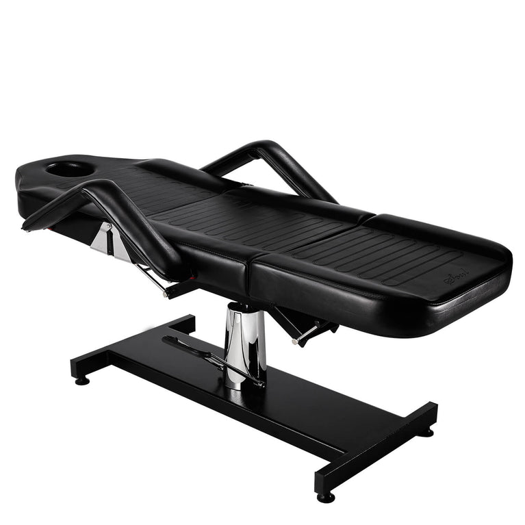 The Hydraulic Pro Lite II Tattoo Chair Bed in Black laid down.