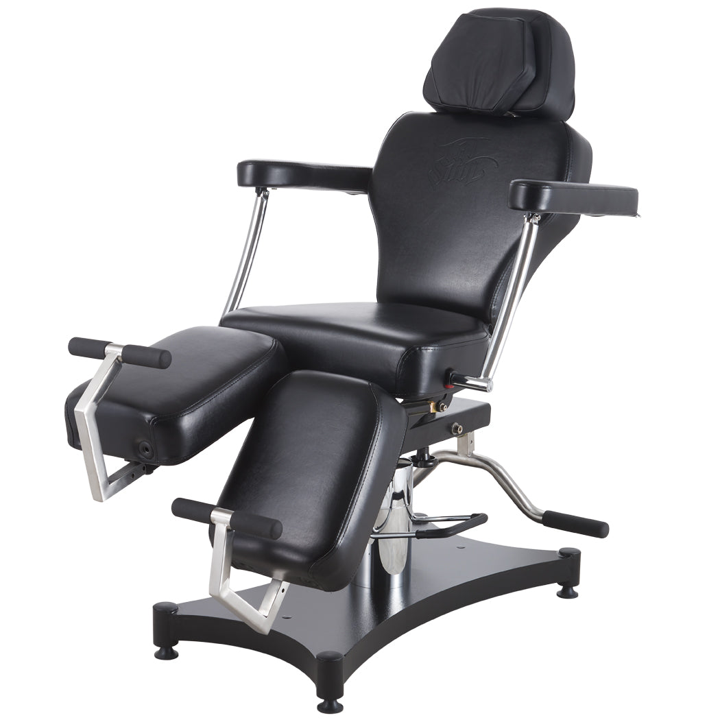The Oros 680 Tattoo Client Chair with one leg of the chair above the other showing adjustability. 