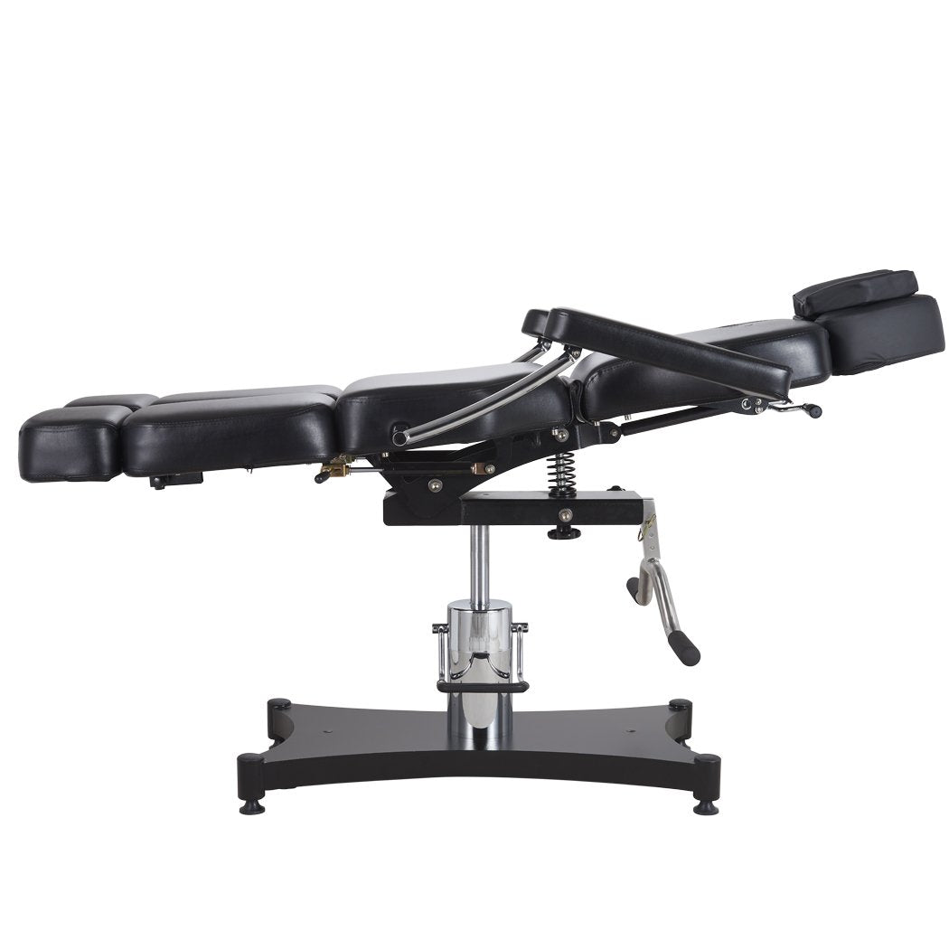 Oros 680 Tattoo Client Chair side view in a laid down position with backrest tilted slightly up.