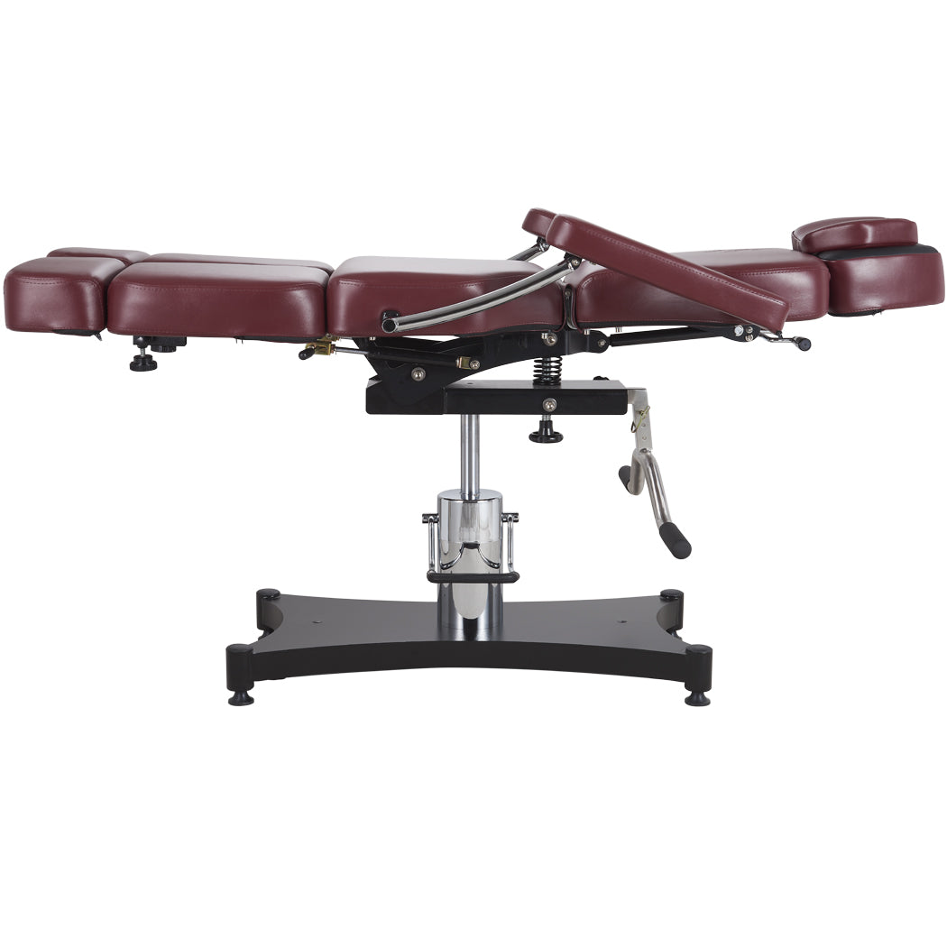 Oros 680 Tattoo Client Chair, Oxblood color, side view in a laid down position.