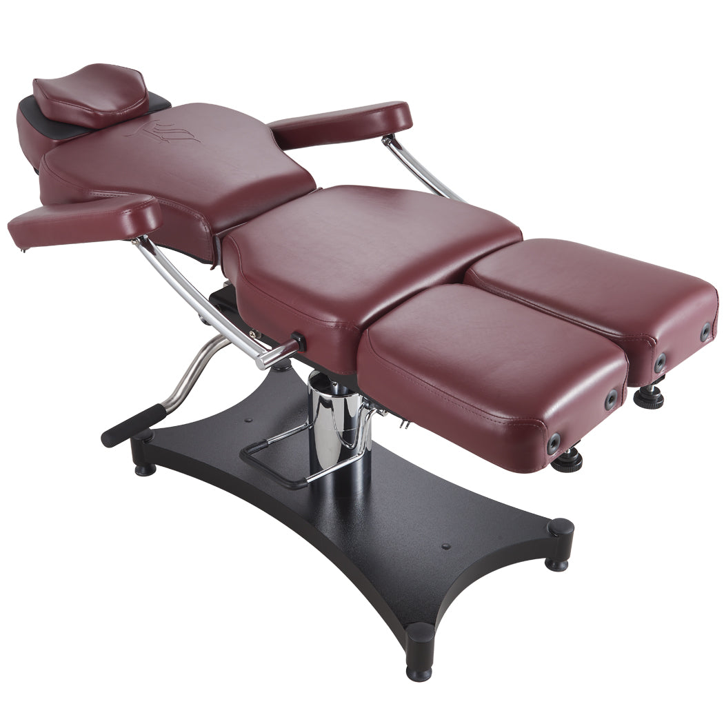 Oros 680 Tattoo Client Chair, Oxblood color, front view laid down with arm rests attached.